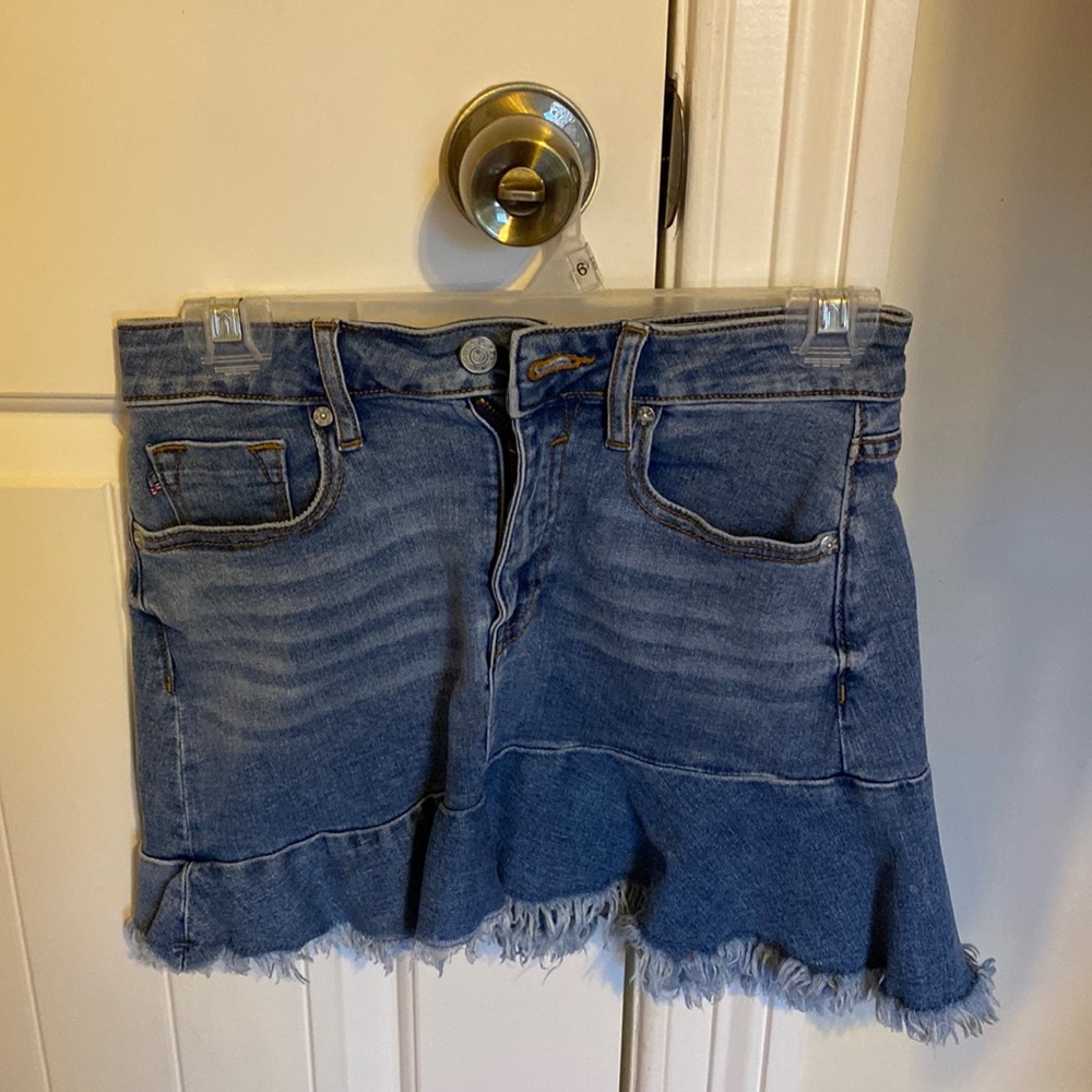 Womens asymmetrical denim skirt with frayed edges